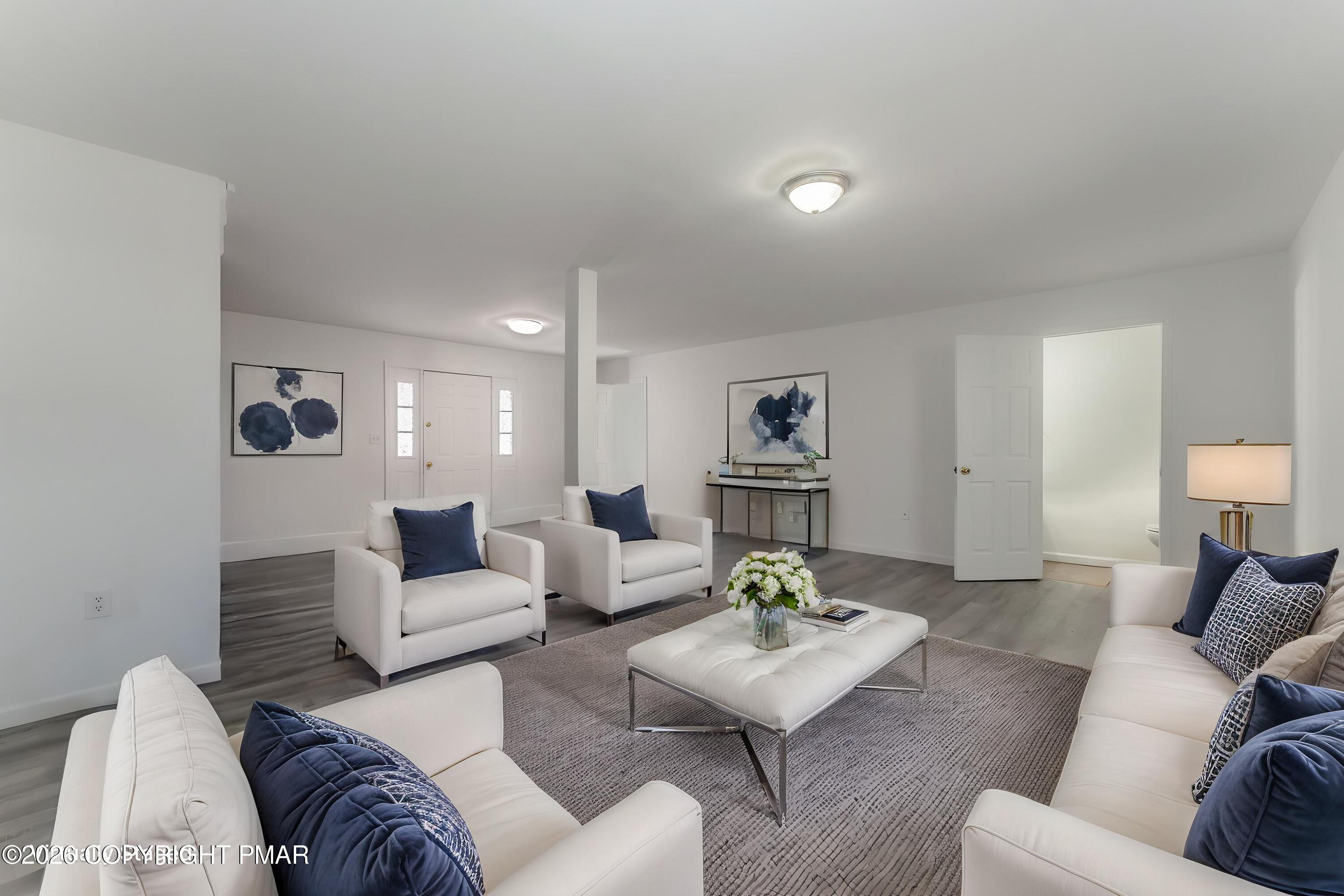 7624 Sawmill Road Tobyhanna, PA 18466 - Photo 2 of 55 a living room with furniture and a wooden floor