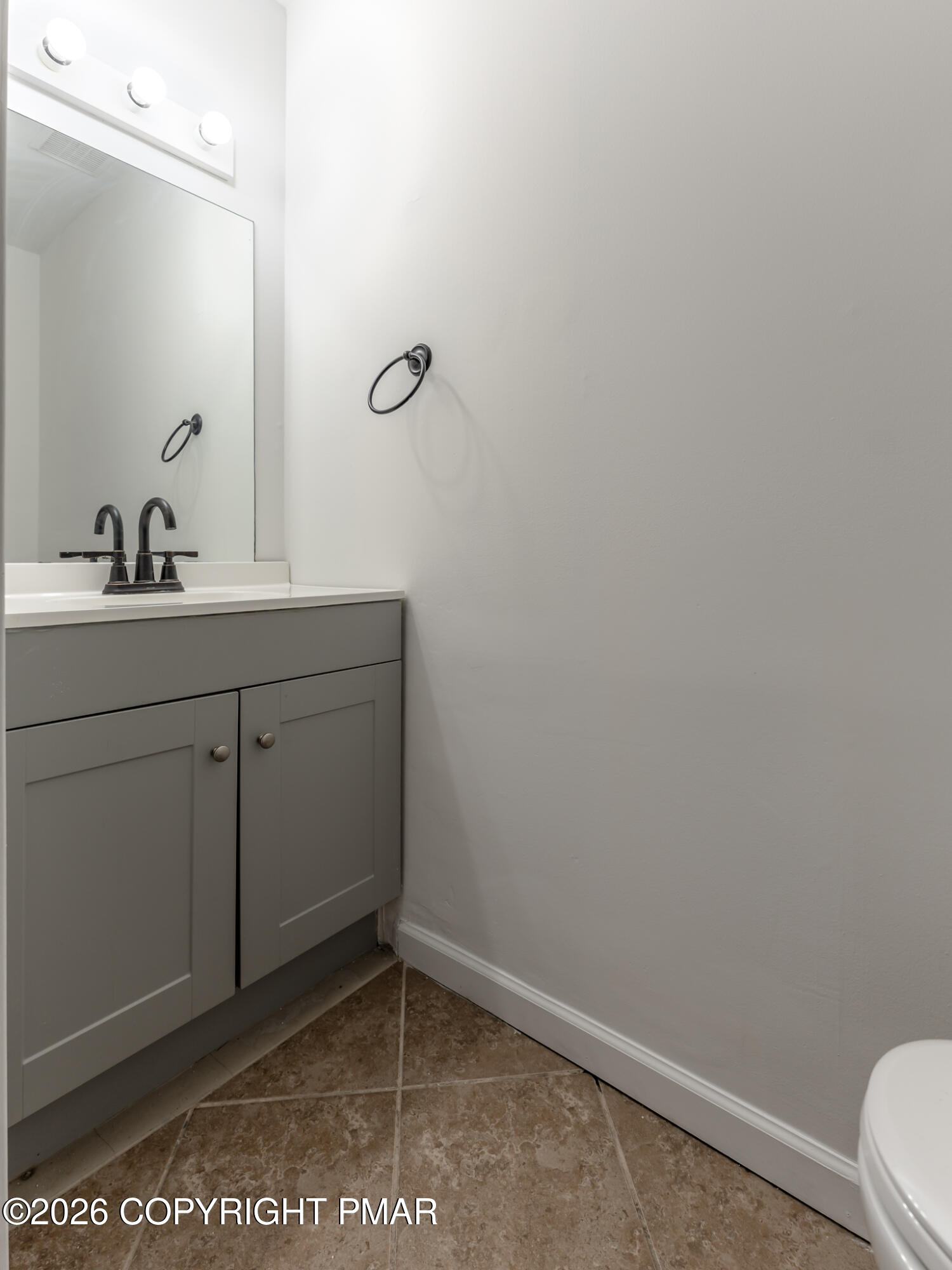 7624 Sawmill Road Tobyhanna, PA 18466 - Photo 21 of 55 a bathroom with a sink a toilet and mirror