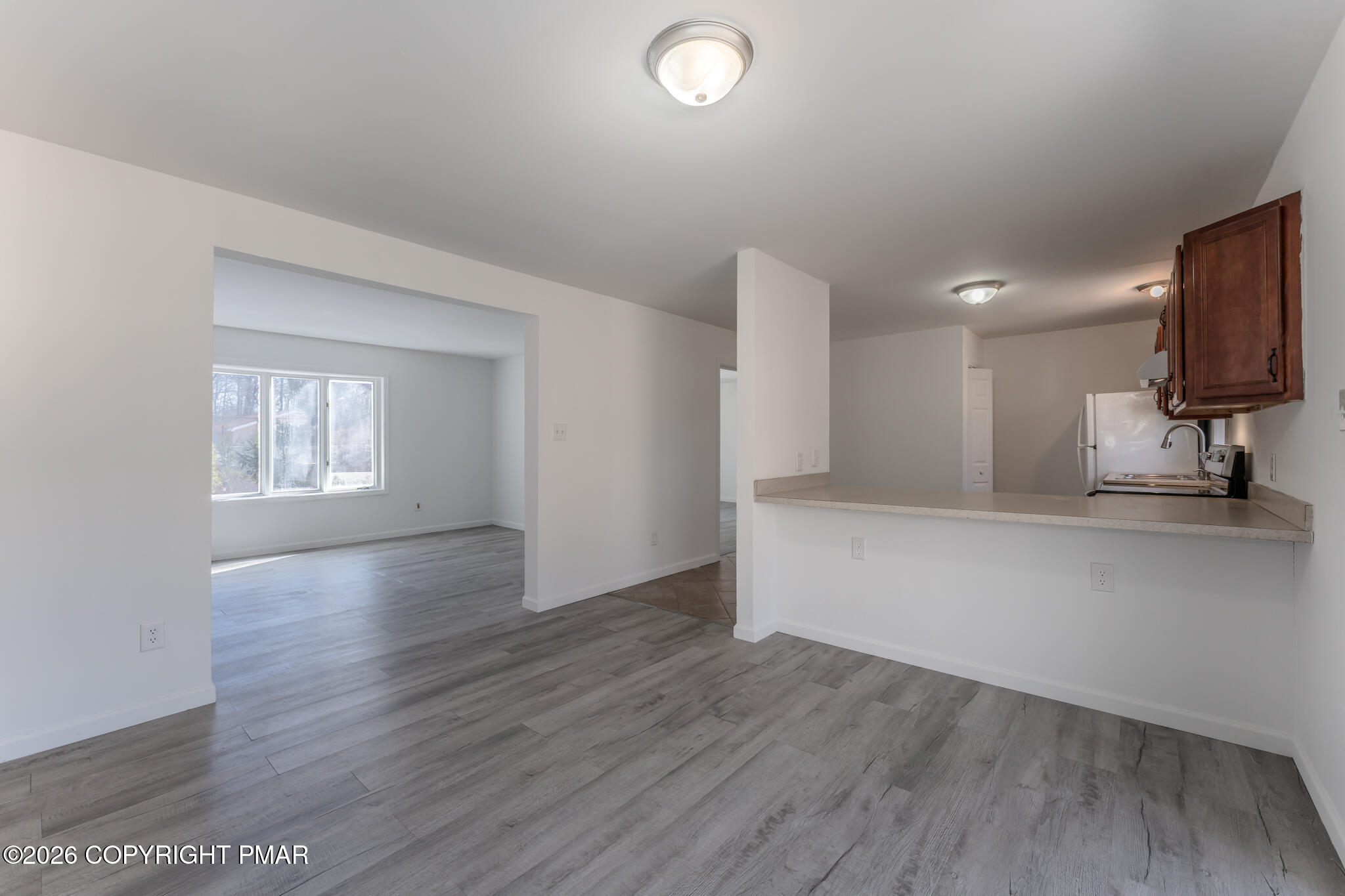 7624 Sawmill Road Tobyhanna, PA 18466 - Photo 24 of 55 an empty room with wooden floor and a window