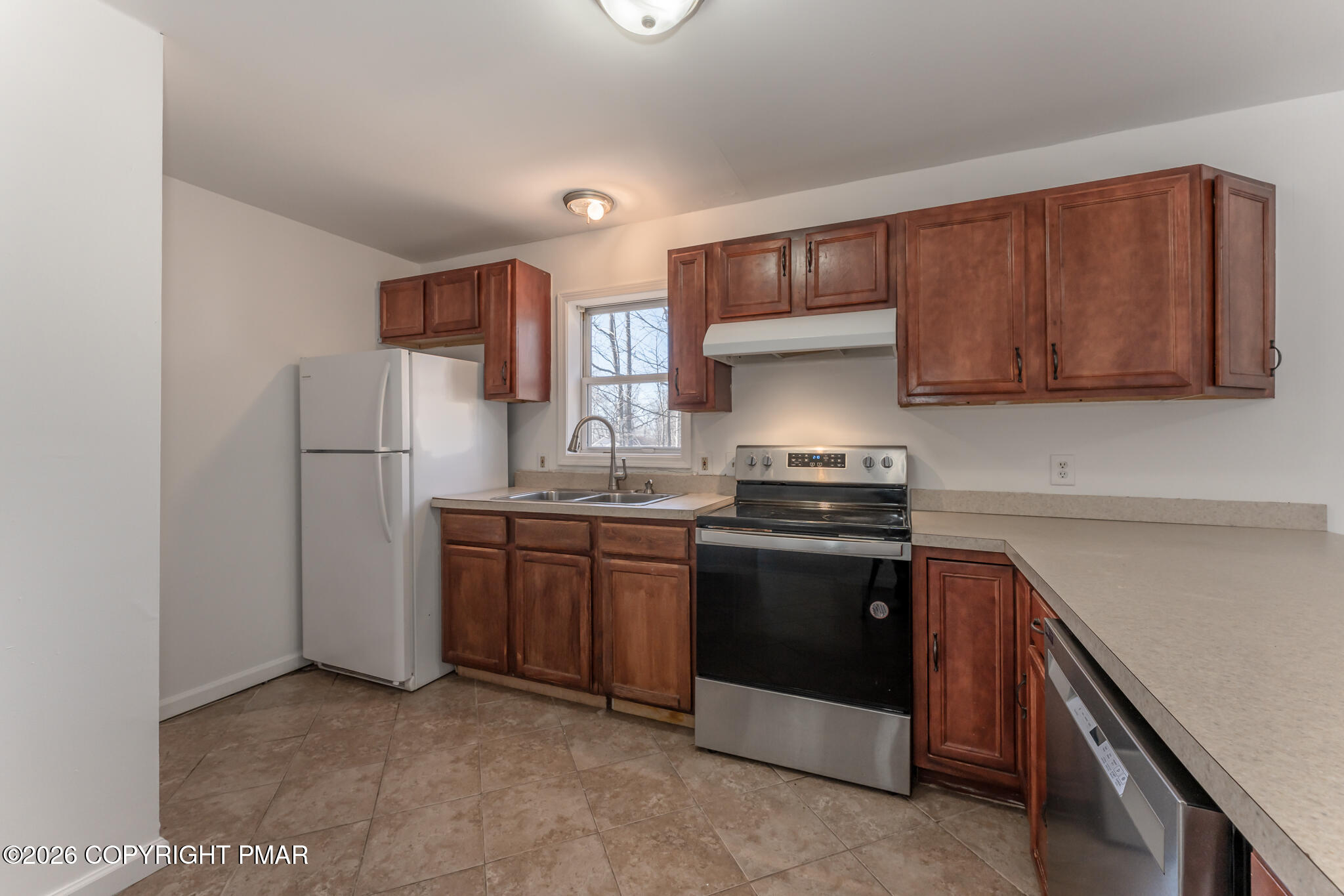 7624 Sawmill Road Tobyhanna, PA 18466 - Photo 29 of 55 a kitchen with stainless steel appliances granite countertop a refrigerator stove and sink