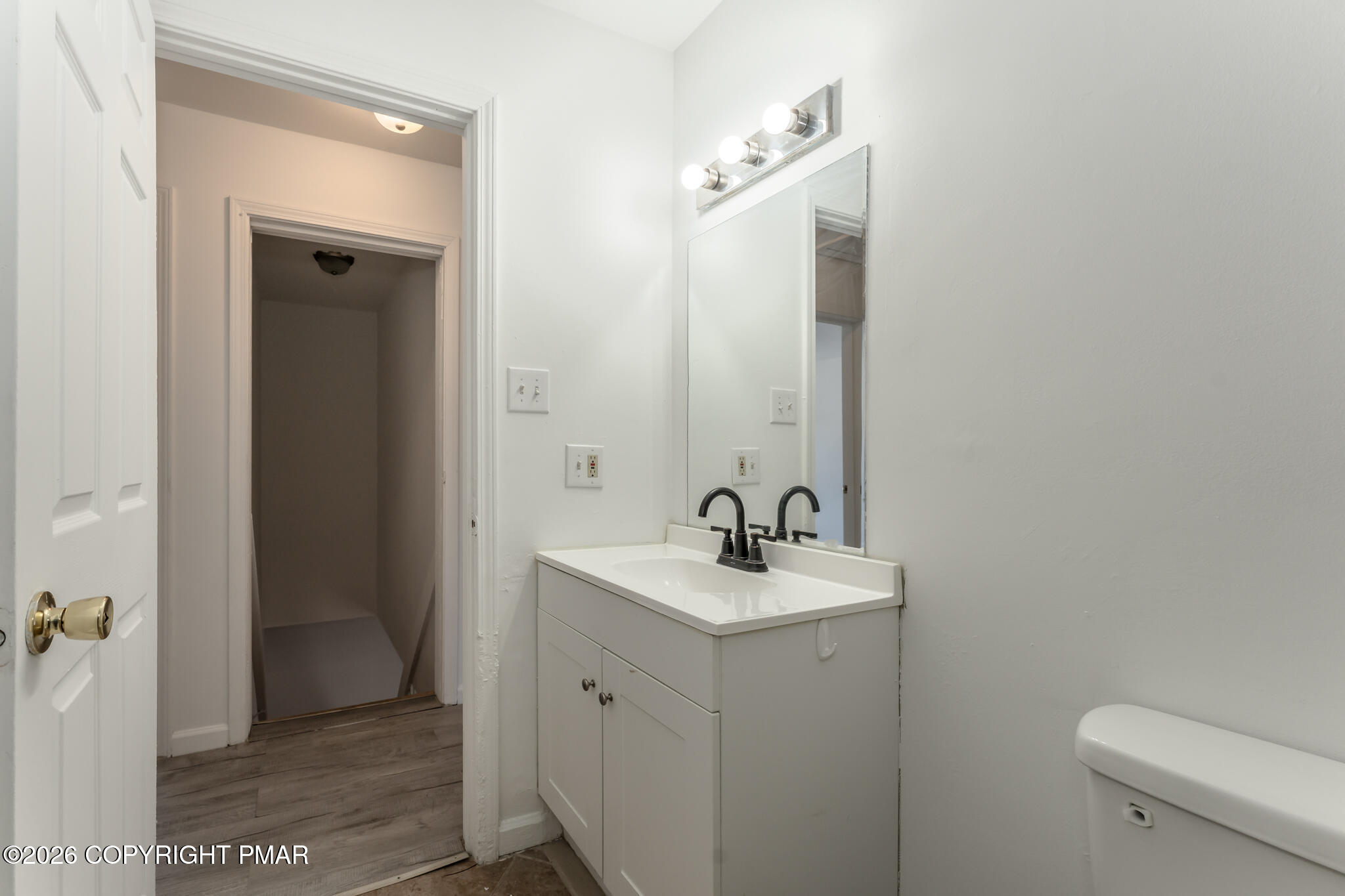 7624 Sawmill Road Tobyhanna, PA 18466 - Photo 46 of 55 a bathroom with a sink a toilet and mirror