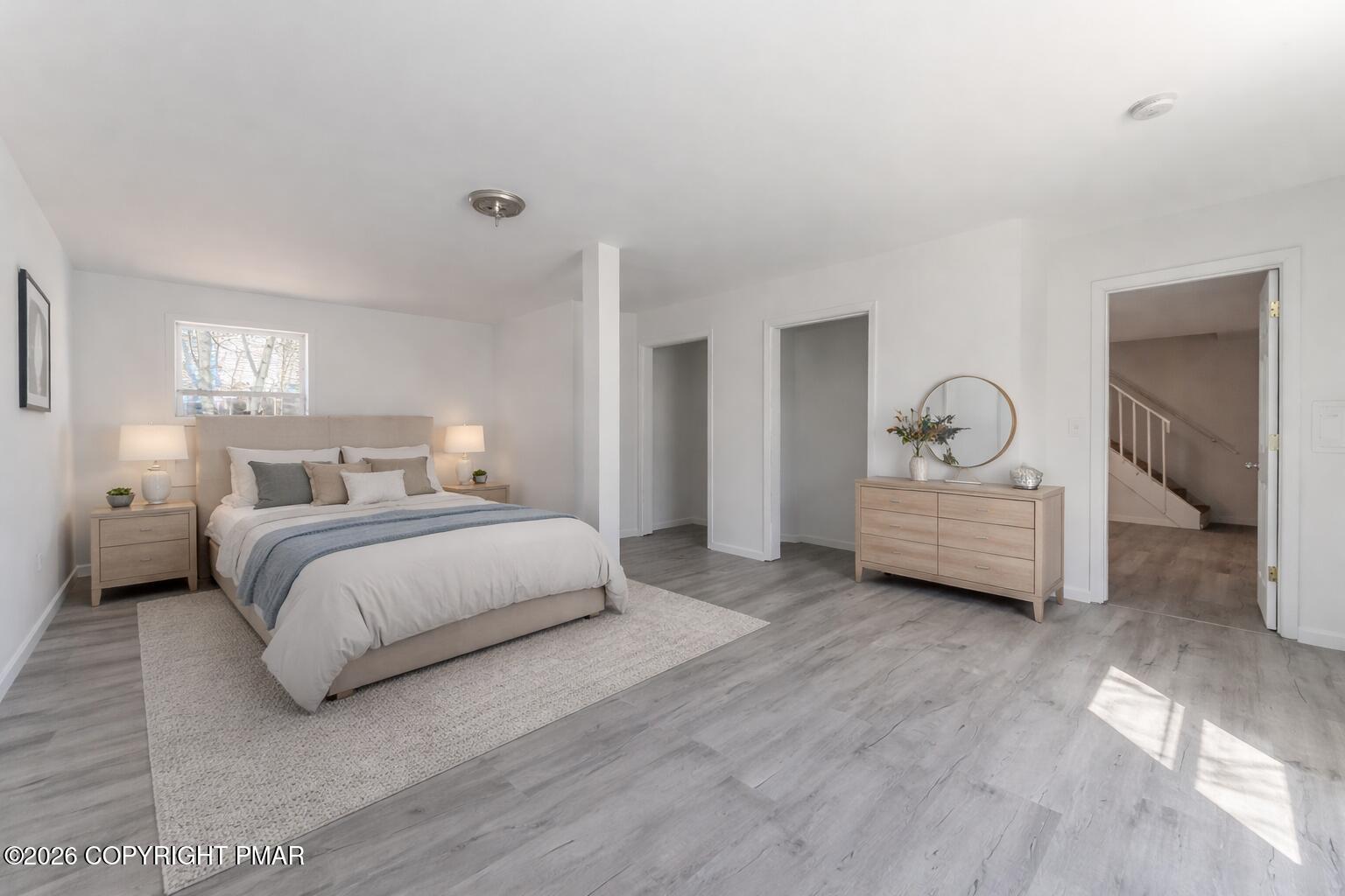 7624 Sawmill Road Tobyhanna, PA 18466 - Photo 8 of 55 a spacious bedroom with a bed and a couch