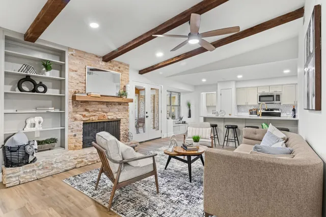 a living room with furniture and a fireplace