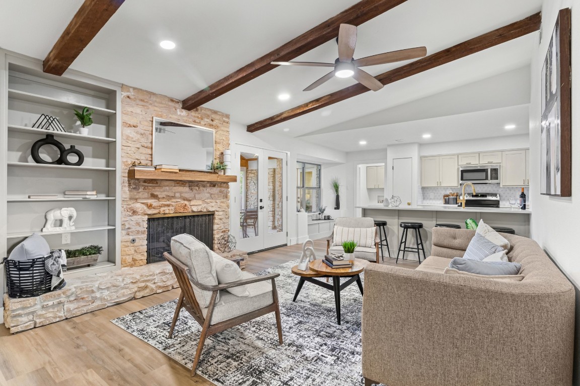 a living room with furniture and a fireplace