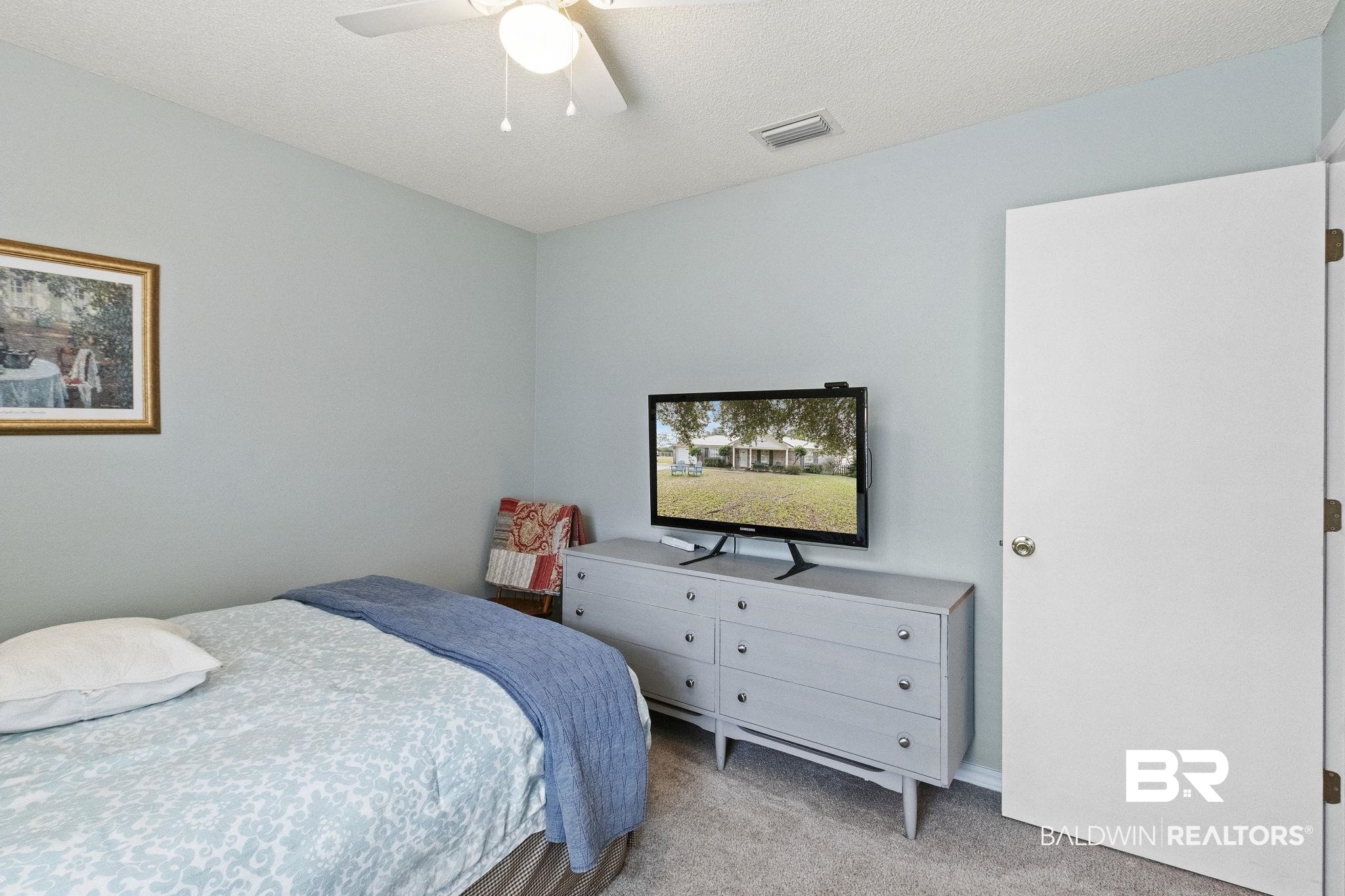 14031 Brook Hollow Road Summerdale, AL 36580 - Photo 36 of 56 Carpeted bedroom with ceiling fan and a textured ceiling