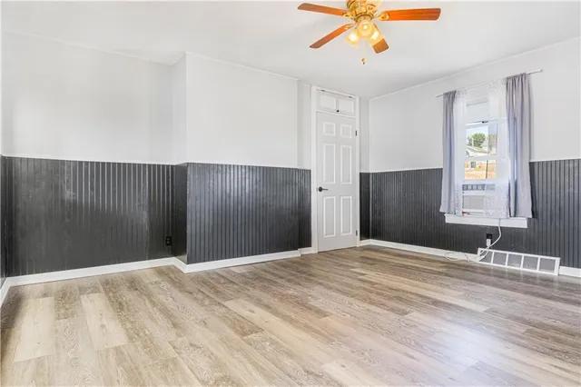 a view of a livingroom with a chandelier fan