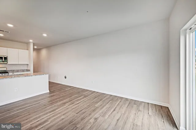 a view of kitchen with wooden floor