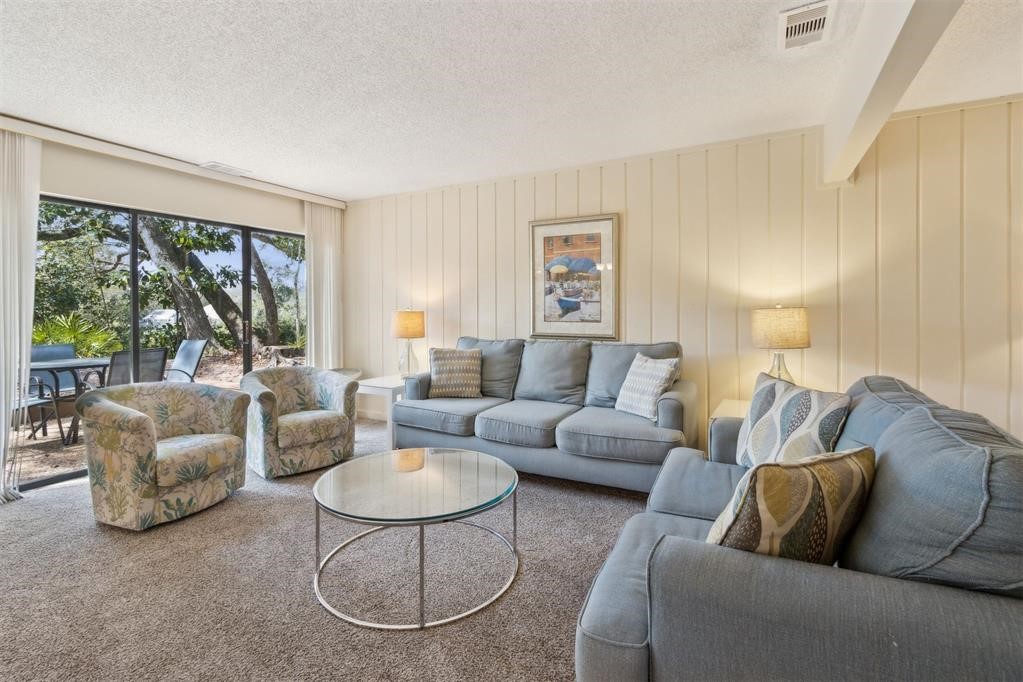2004 Beachwood Road, Unit 2004 Fernandina Beach, FL 32034 - Photo 7 of 54 a living room with furniture and a large window