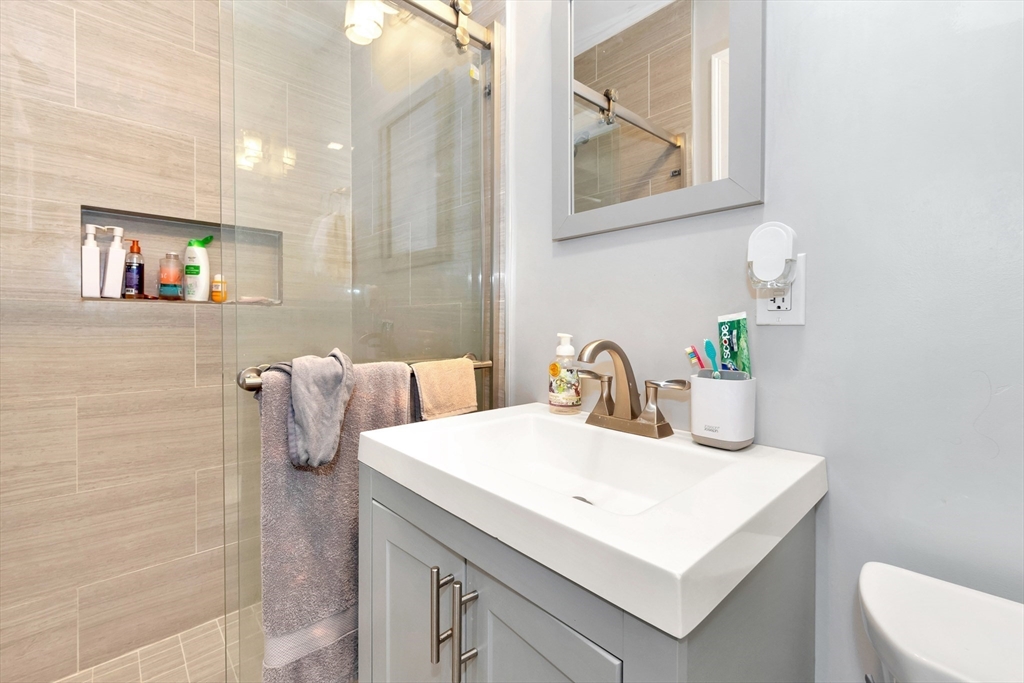27 Dudley Street Boston, MA 02119 - Photo 28 of 42 a bathroom with a sink and a mirror