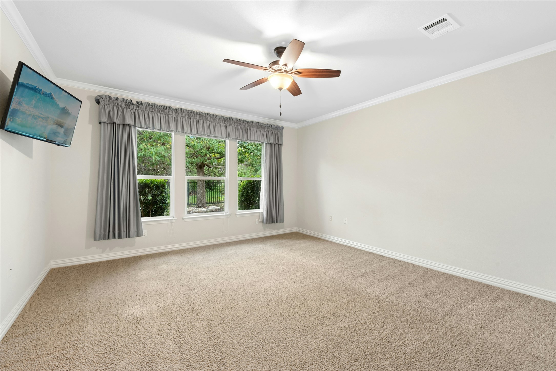 227 Duck Creek Lane Georgetown, TX 78633 - Photo 13 of 40 a view of a livingroom with a ceiling fan and window