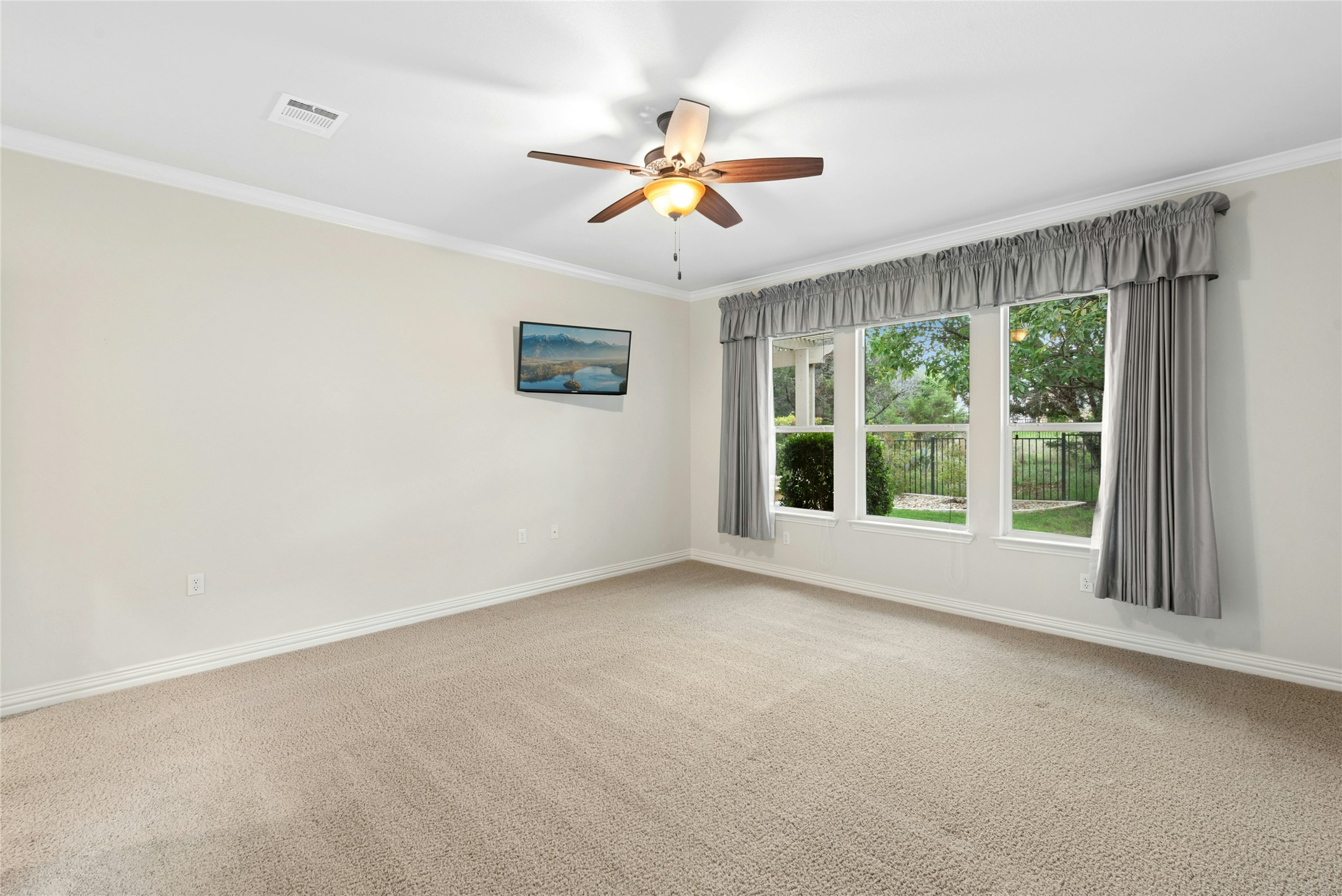 227 Duck Creek Lane Georgetown, TX 78633 - Photo 14 of 40 a view of a livingroom with a ceiling fan and window