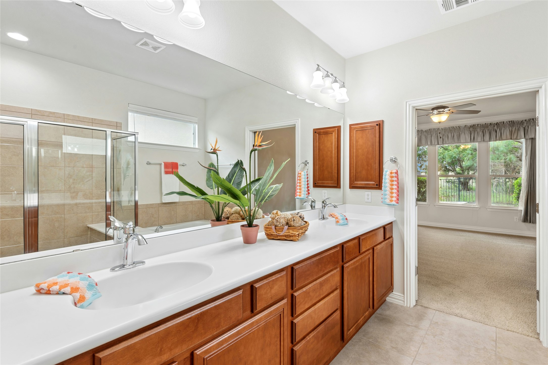 227 Duck Creek Lane Georgetown, TX 78633 - Photo 16 of 40 a bathroom with a granite countertop sink and mirror
