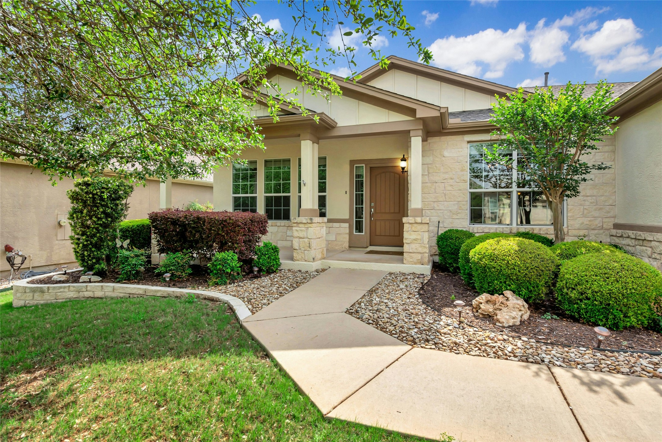 227 Duck Creek Lane Georgetown, TX 78633 - Photo 1 of 40 a front view of a house with a yard and potted plants