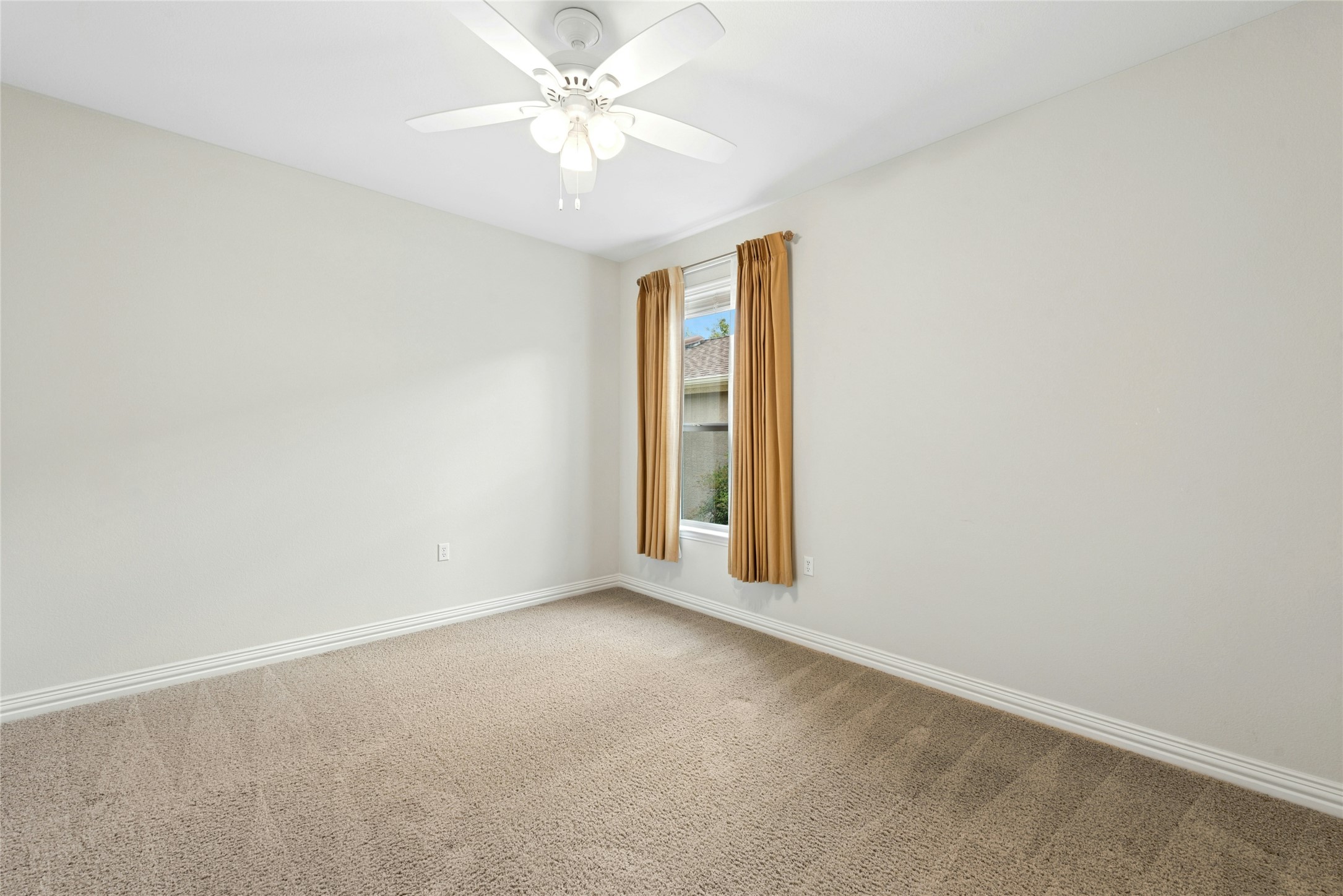 227 Duck Creek Lane Georgetown, TX 78633 - Photo 20 of 40 an empty room with a window and a fan