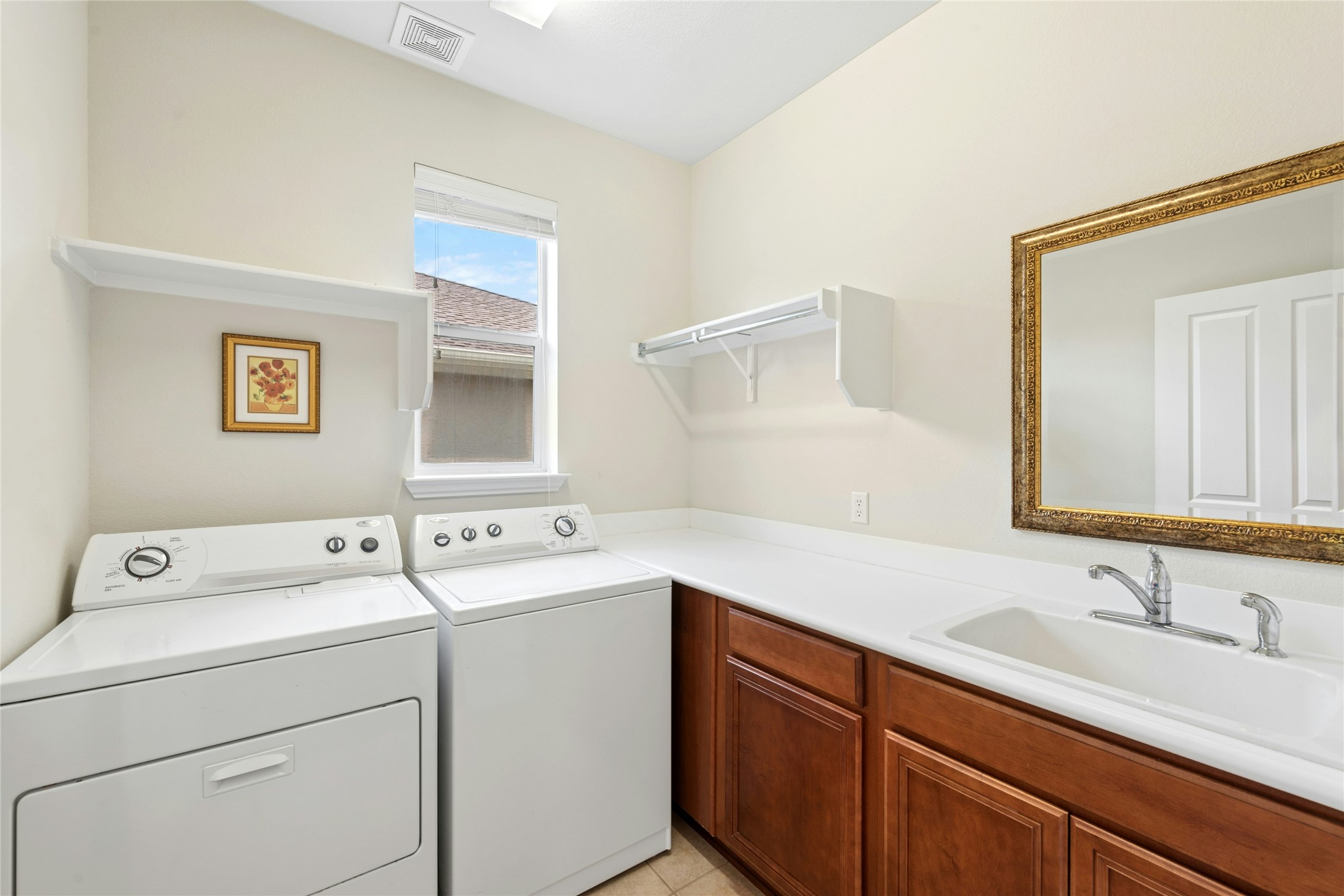 227 Duck Creek Lane Georgetown, TX 78633 - Photo 24 of 40 a utility room with dryer and washer
