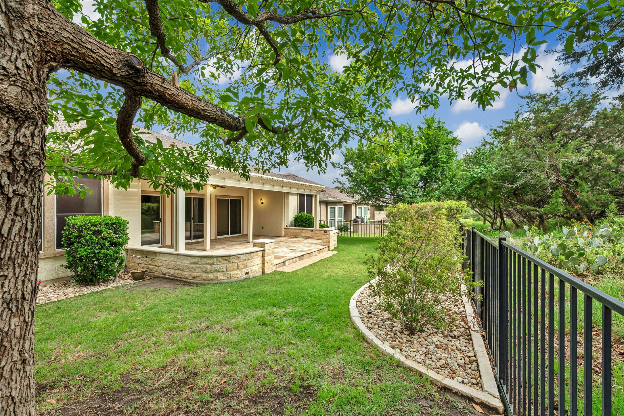 227 Duck Creek Lane Georgetown, TX 78633 - Photo 28 of 40 a view of a house with backyard and sitting area