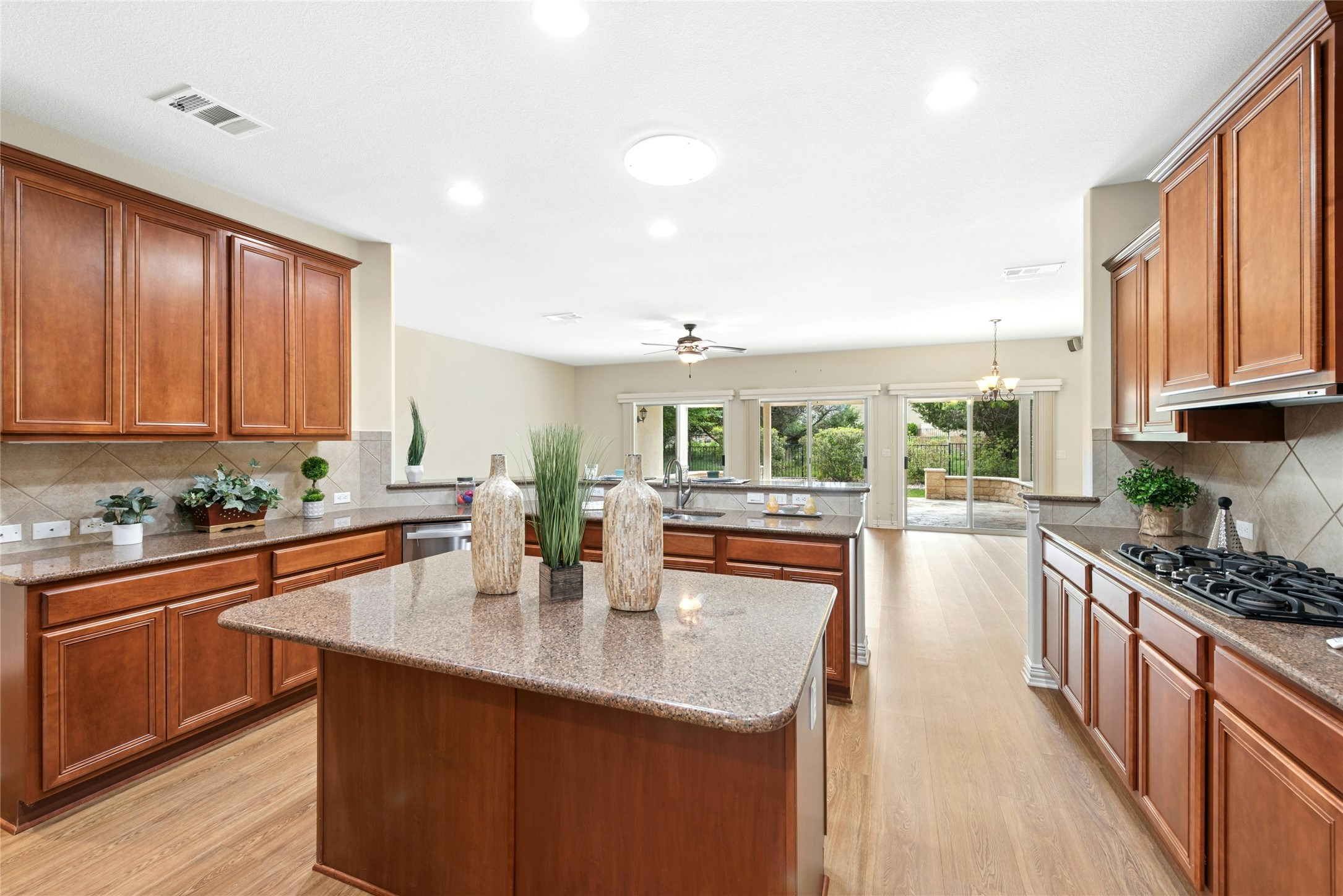 227 Duck Creek Lane Georgetown, TX 78633 - Photo 5 of 40 a kitchen with stainless steel appliances granite countertop a sink stove and cabinets