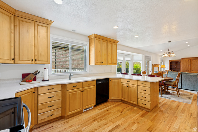 298 North Canyon Road Bountiful, UT 84010 - Photo 21 of 57 Open-concept kitchen featuring light wood cabinetry, white countertops, wood-finish flooring, a stainless steel sink, and recessed lighting