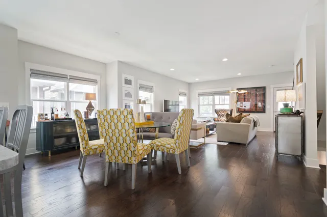 a view of room with wooden floor and windows