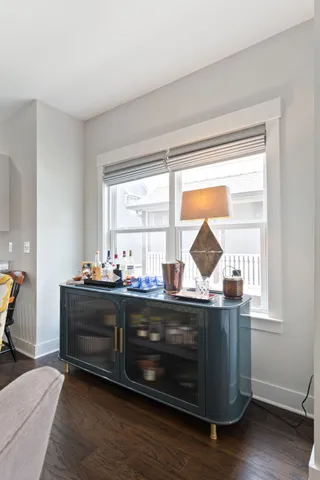 a kitchen with appliances cabinets and chair