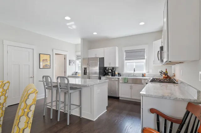 a kitchen with a sink stove and refrigerator