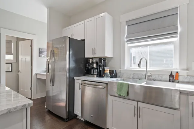 a view of a wooden deck and a yard