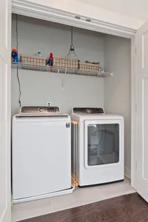 a view of hallway with wooden floor