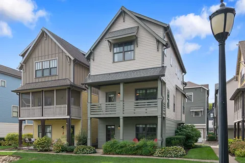 a front view of a residential apartment building with a yard
