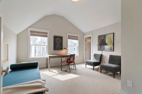 a room with furniture and air hockey table