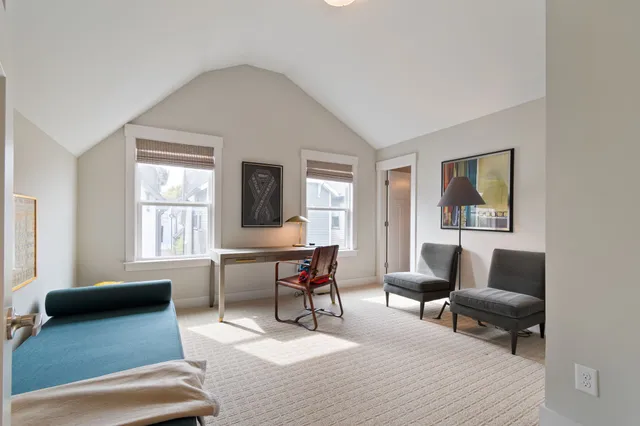 a room with furniture and air hockey table