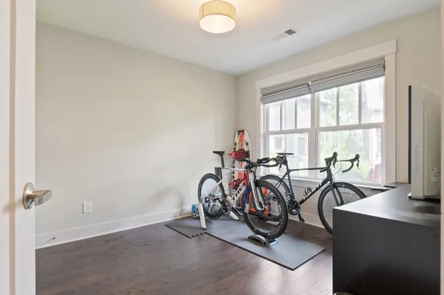 a bathroom with a sink mirror and shower