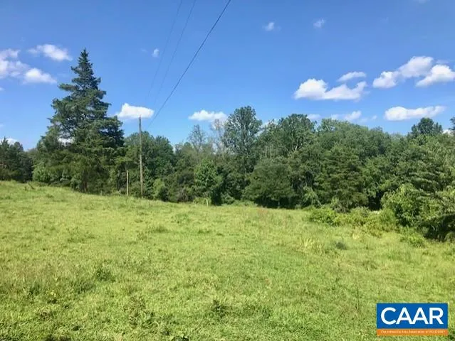 a large yard with lots of green space