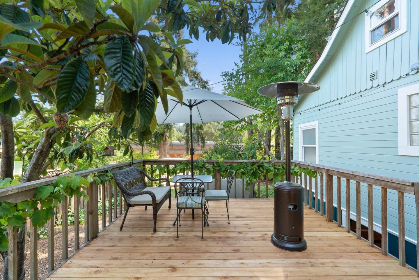 280 Main Street Ben Lomond, CA 95005 - Photo 42 of 47 a patio with wooden floor a yard a table and chairs