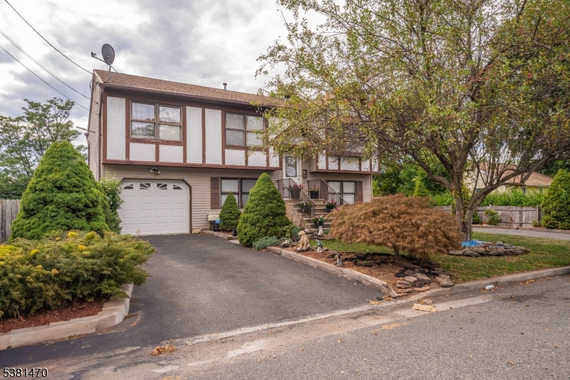 1 Hall Street Piscataway, NJ 08854 - Photo 2 of 21 a front view of a house with garden