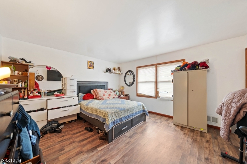 1 Hall Street Piscataway, NJ 08854 - Photo 10 of 21 a bedroom with a bed and a large window