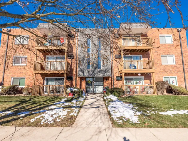 a city street lined with buildings and trees
