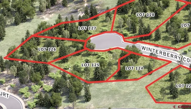 a sign that is sitting in front of flowers