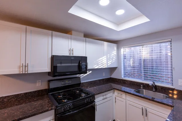 a kitchen with a stove and a microwave