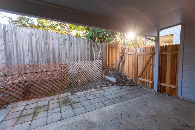 a view of a pathway both side of house