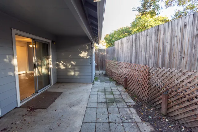a view of staircase with railing and a window