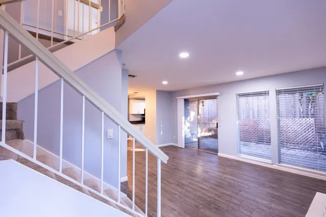 a view of an entryway with wooden floor