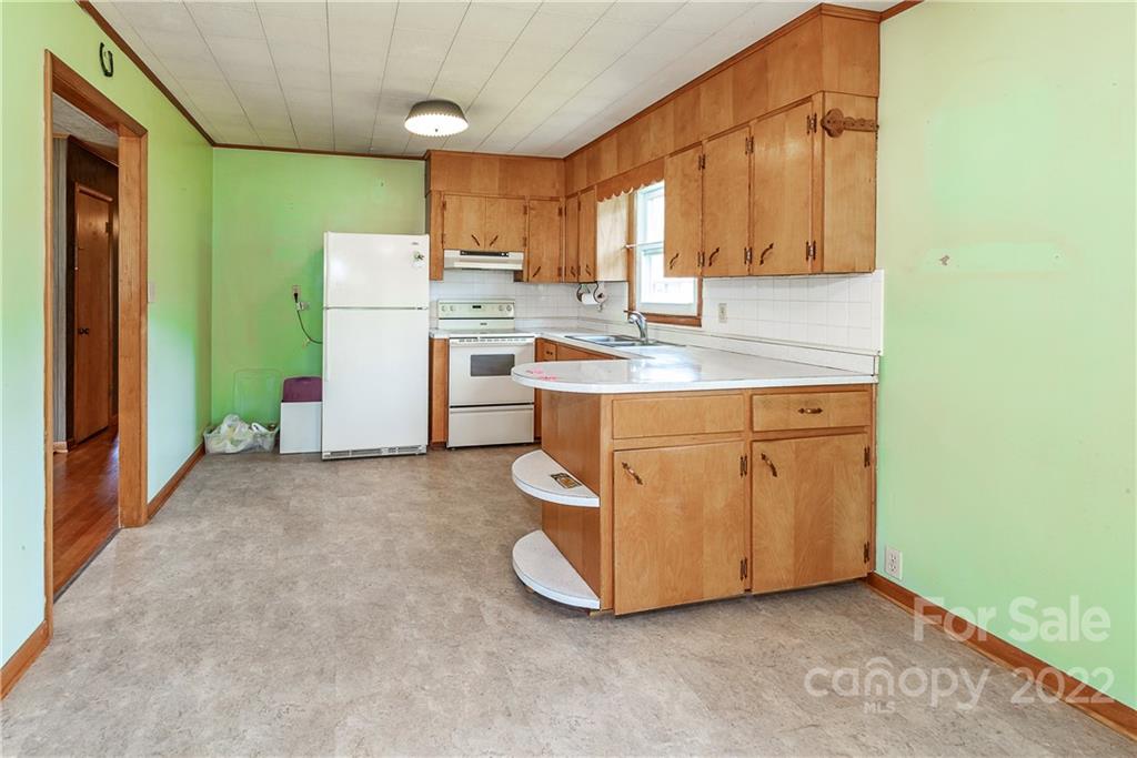 2 Riversedge Way Canton, NC 28716 - Photo 12 of 28 a utility room with cabinets washer and dryer