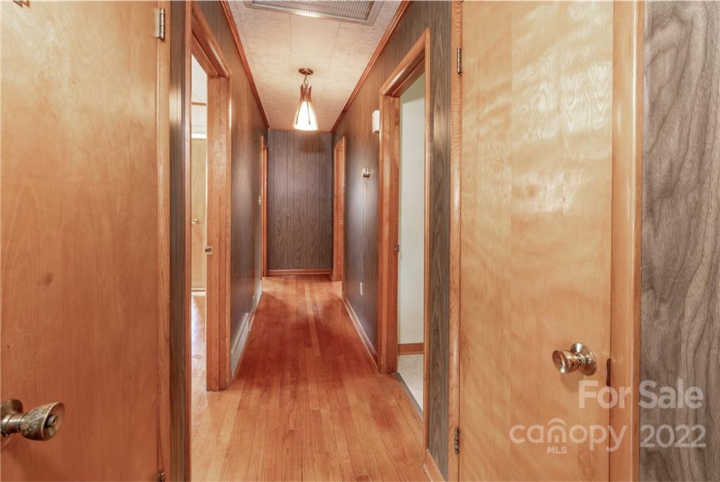 2 Riversedge Way Canton, NC 28716 - Photo 15 of 28 a view of a hallway with wooden floor and staircase