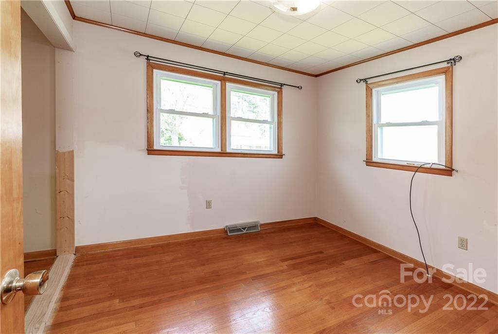 2 Riversedge Way Canton, NC 28716 - Photo 19 of 28 an empty room with wooden floor and windows