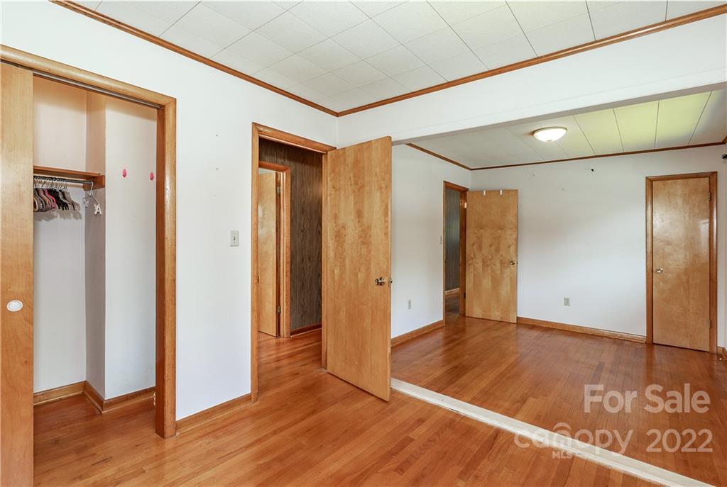 2 Riversedge Way Canton, NC 28716 - Photo 21 of 28 a view of a hallway with wooden floor