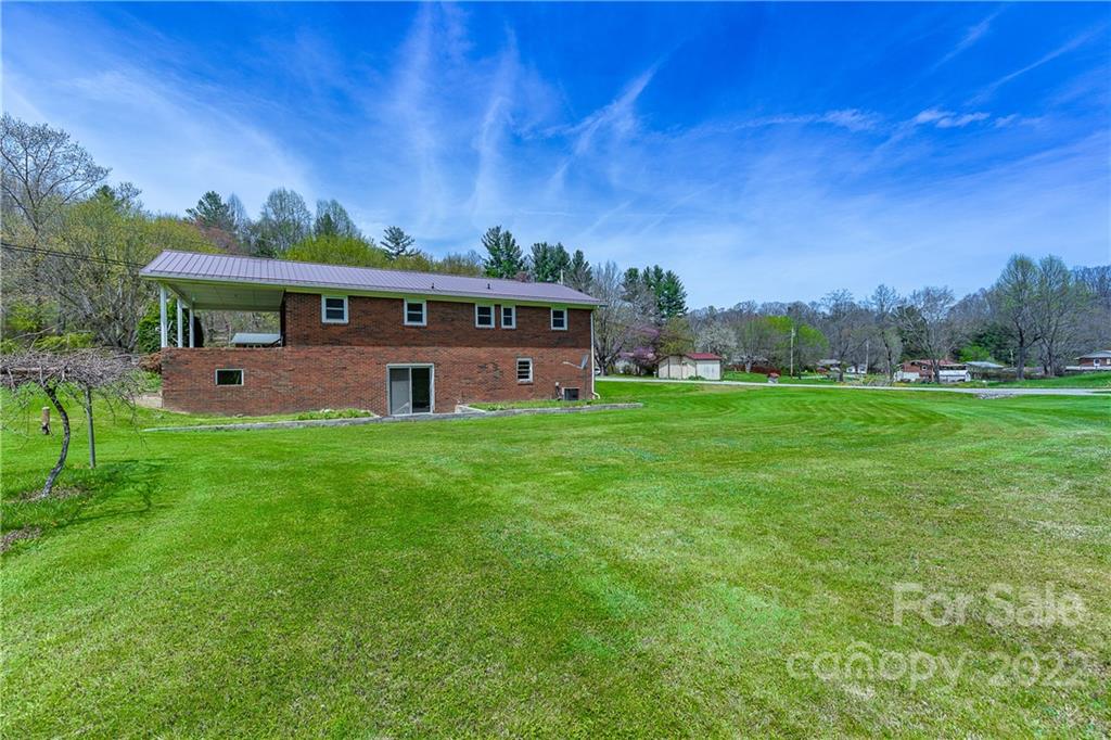 2 Riversedge Way Canton, NC 28716 - Photo 4 of 28 a front view of a house with a yard