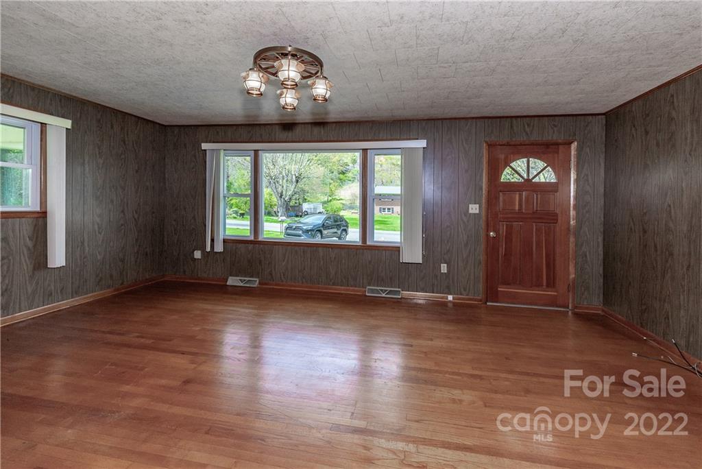 2 Riversedge Way Canton, NC 28716 - Photo 6 of 28 an empty room with wooden floor and windows