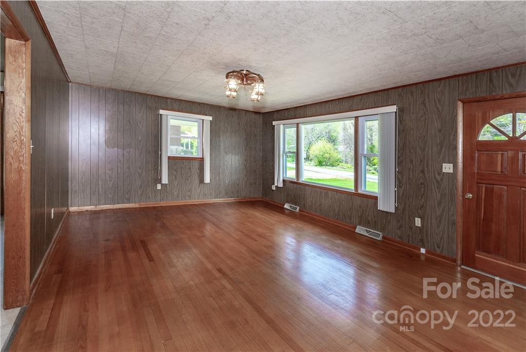 2 Riversedge Way Canton, NC 28716 - Photo 7 of 28 an empty room with wooden floor and windows