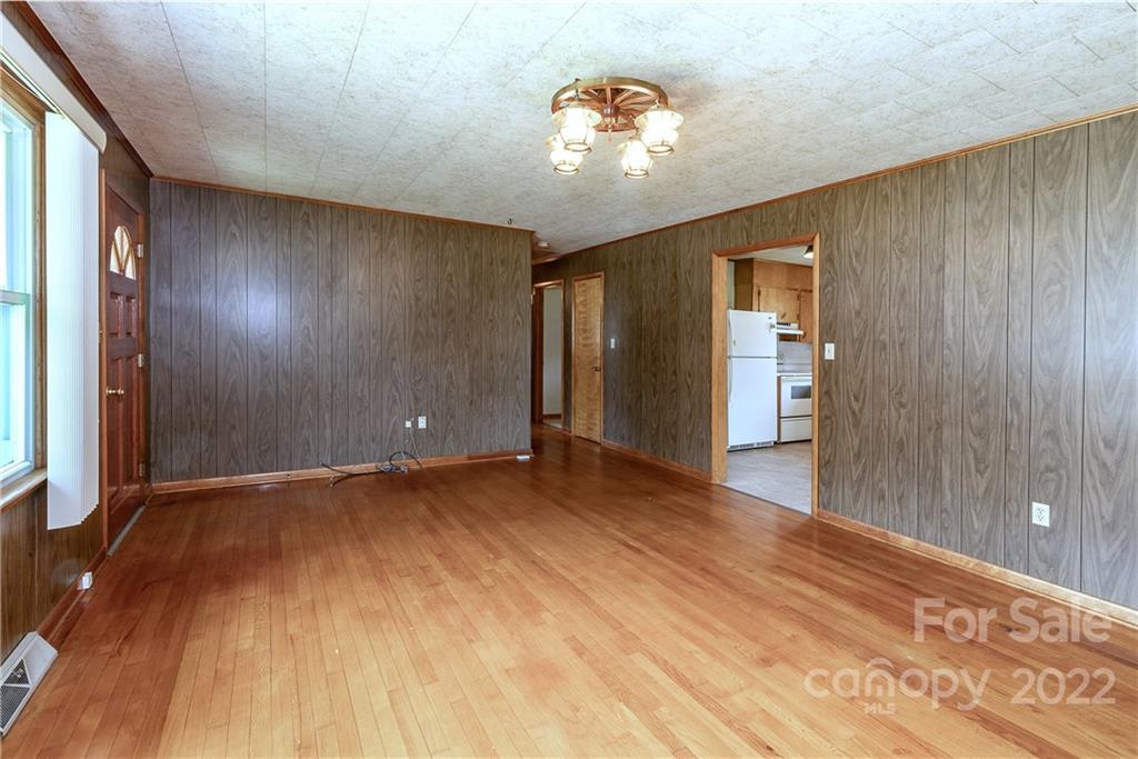 2 Riversedge Way Canton, NC 28716 - Photo 8 of 28 a view of an empty room with wooden floor