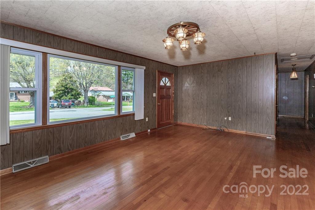2 Riversedge Way Canton, NC 28716 - Photo 9 of 28 an empty room with wooden floor and windows